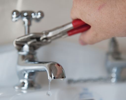 Emergency service repair on faucet