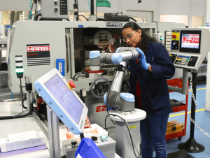 Universal Robots Cobots being used by industrial worker
